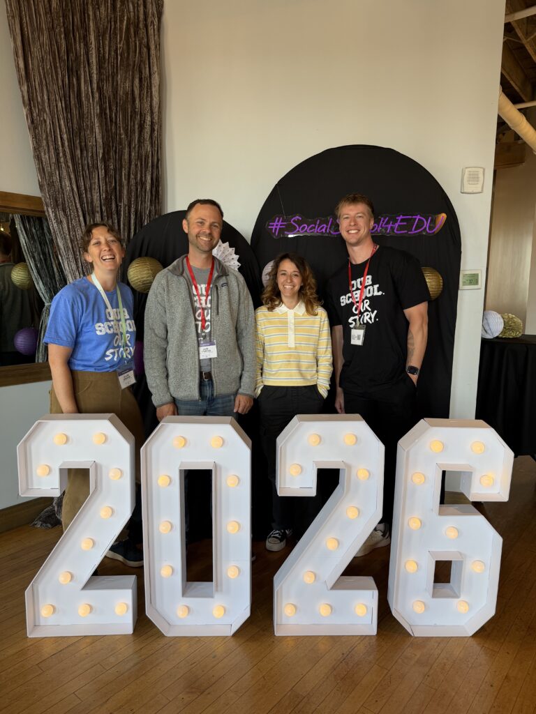 Claire, Sam, Xandra, and Jake at a conference